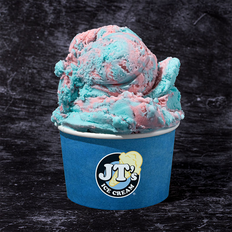 A delicious scoop of JT's Cotton Candy ice cream in a blue JT's ice cream cup.